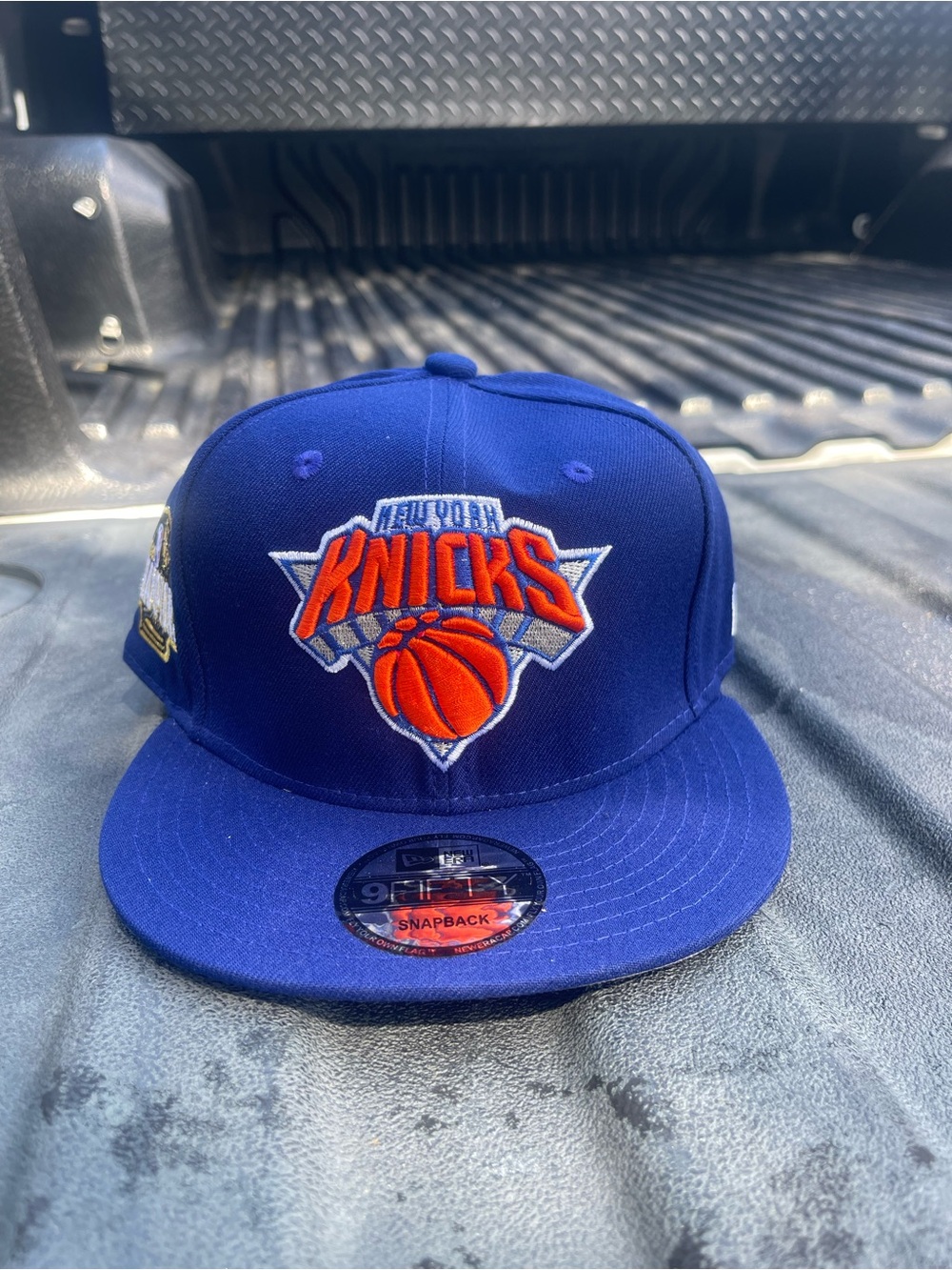New Era Blue New York Knicks 2025-2026 nba championSnapback Hat with Orange Logo